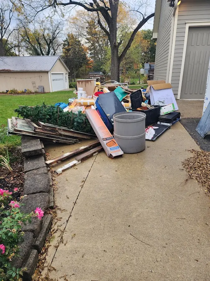 Dumpster being loaded with debris for Residential Dumpster Rental in Stephenville
